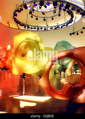 Brightly colored fiberglass fish at the Seaglass carousel in battery Park NYC Stock Photo