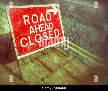 Road ahead closed road sign on a footpath Stock Photo