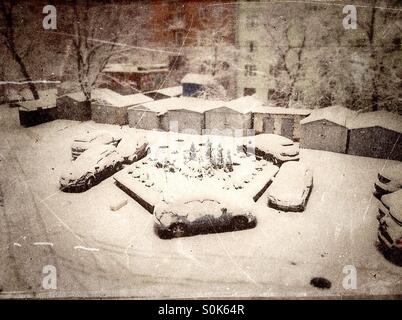 Cars got stuck in the snow in the courtyard of an apartment after a ...