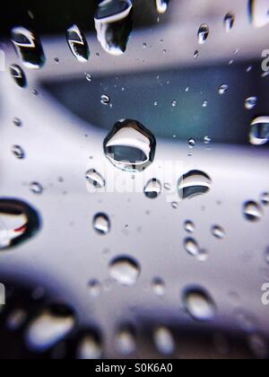 Raindrops on a car window Stock Photo