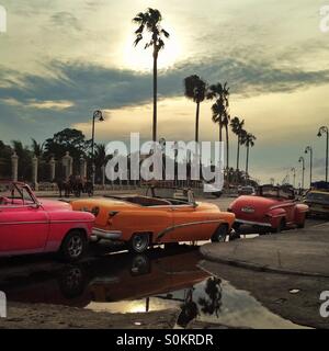 Classic cars lined up on the Malecon, Havana, Cuba Stock Photo