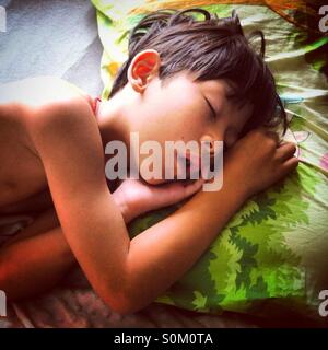 The young boy is sleeping Stock Photo