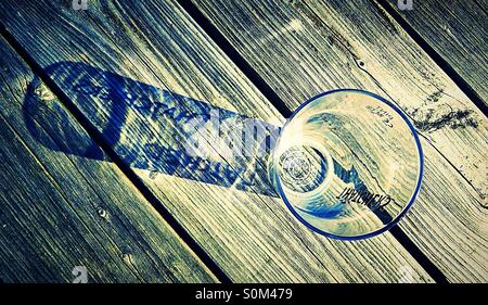 Thatchers cider glass with shadow reflection of name Stock Photo