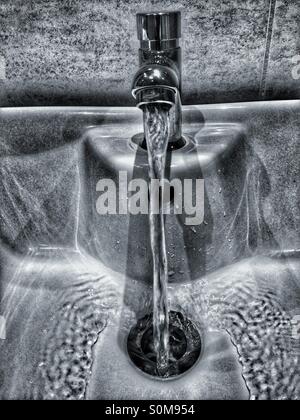 Running tap, flowing water Stock Photo