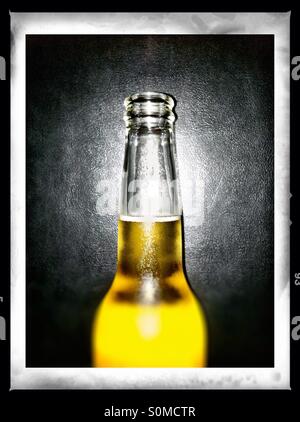 Cold beer bottle against black Stock Photo