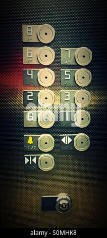 Floor numbers on lift elevator panel Stock Photo