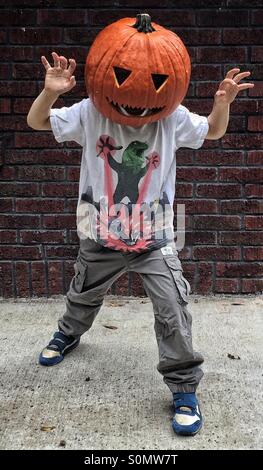 Jack Pumpkinhead, boy wearing a mask. Jack o lantern. Stock Photo