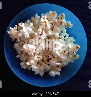 Popcorn in blue toddler bowl