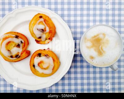 Pains aux raisins with coffee Stock Photo