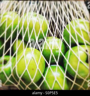 String shopping bag with green apples Stock Photo