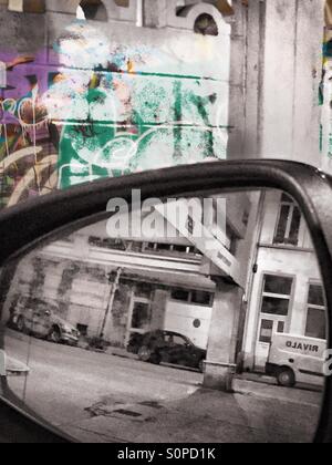Building structures seen through a rear view mirror Stock Photo - Alamy