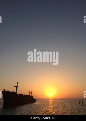 The greek ship wreckage in kish island at sunset Stock Photo