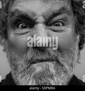 Man, age 64, frowning, black and white - model released Stock Photo