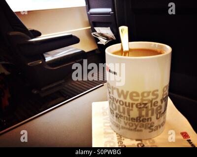Coffee with milk while traveling in the first class coach of the ICE train of the German Deutsche Bahn, Germany Stock Photo