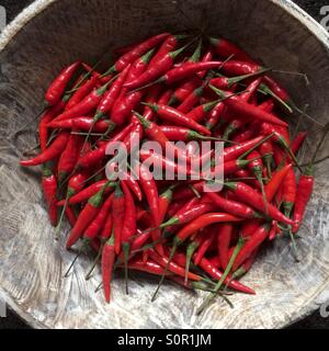 Red Chillies in wooden bowl Stock Photo