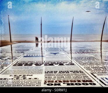 Couple taking selfie on the Comedy Carpet mosaic on Blackpool promenade Stock Photo