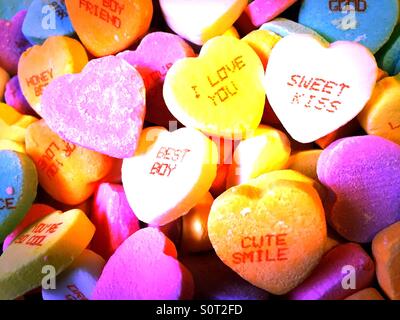 Valentine's Day candy conversation hearts in vibrant colors. Stock Photo