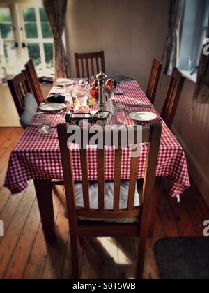 Table set for lunch in an English farmhouse kitchen Stock Photo