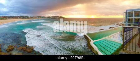 A panoramic shot of Bondi Beach and the Bondi Icebergs club and pool on Australia Day January 26th 2016 at 6.00am Stock Photo