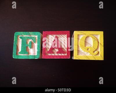 ABC Wood blocks used to spell the abbreviation FAQ, frequently asked questions Stock Photo