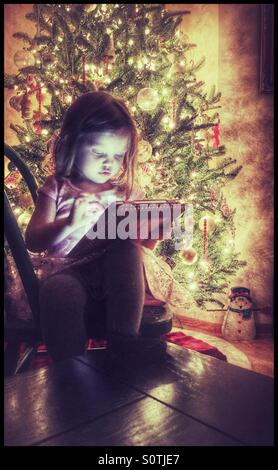 Little girl using a tablet Stock Photo