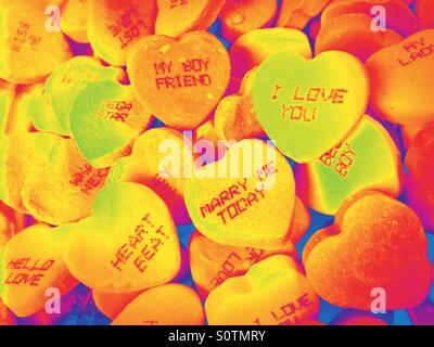 Red hot Valentines Day candy conversation hearts. Stock Photo