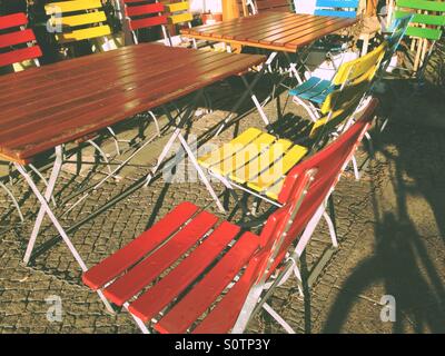 Colourful chairs in front of a restaurant cafe in Berlin Kreuzberg, Germany Stock Photo