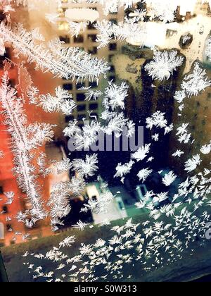 Ice crystals formed on the inside of a window pane in New York City during a blizzard Stock Photo