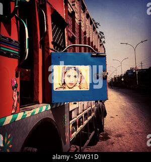 A truck with a poster of an Indian actress in the suburbs of National Capital Territory of Delhi, India Stock Photo