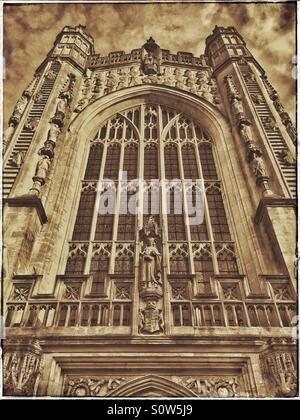 A view looking skyward of the West Front of Bath Abbey. Of interest are the 2 Ladders of Angels descending and ascending. Photo Credit - © COLIN HOSKINS. Stock Photo