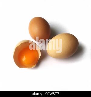 2 eggs and 1 eggyolk Stock Photo