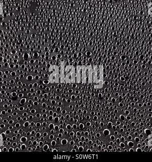 Water condensation droplets on a sheet of glass. Stock Photo