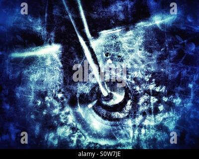 Water running down the drain in bathroom sink Stock Photo