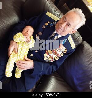 Grandfather holding a baby Stock Photo