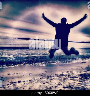 Happy man on the beach, Mediterranean Sea Stock Photo