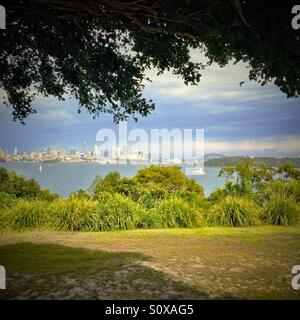 Sydney harbour looking towards Sydney Harbour Bridge and the Opera House with a Sea Plane taking off from Rose Bay. Stock Photo