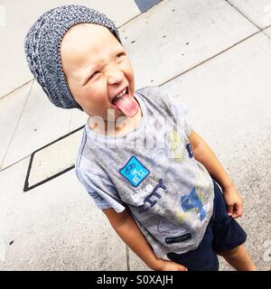 Little boy making funny face Stock Photo