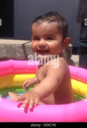 Little baby bathing in a tub Stock Photo