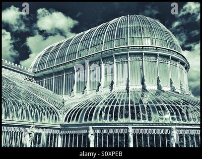 An Exterior View of The Palm House in Belfast Botanic Gardens. Built 1839 to 1840, this large Greenhouse is a fantastic example of a Curvilinear Cast Iron Glasshouse. Photo Credit - © COLIN HOSKINS. Stock Photo