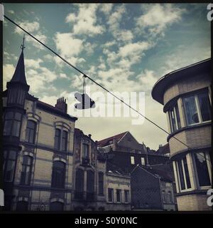 Shoes on wire, Brussels, Belgium Stock Photo