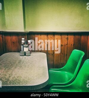 Green seats in a cafe Stock Photo