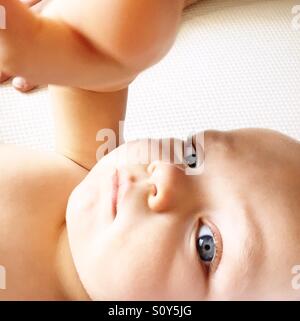 Cute little baby looking at camera Stock Photo