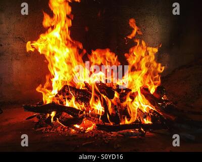 Fire burning in indoor fireplace Stock Photo