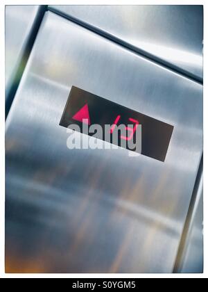 Elevator floor indicator light. Going up to 13th floor. Stock Photo