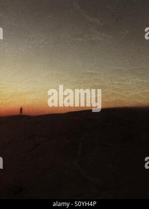 silhouette of a lonely man in sunset Stock Photo - Alamy
