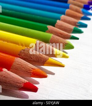 Sharpened colored pencil tips in a row macro shot Stock Photo