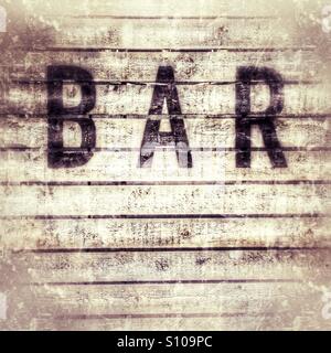 Bar sign psinted on distressed wood Stock Photo