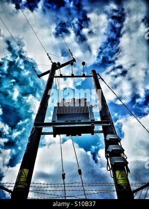 Transformer with overhead power cables Stock Photo