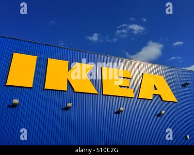 The Yellow IKEA sign on the blue exterior wall of the IKEA Retail Complex in Bristol, England. Photo Credit - © COLIN HOSKINS. Stock Photo