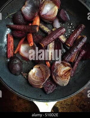 Pan roasted beet root, onions and carrots Stock Photo